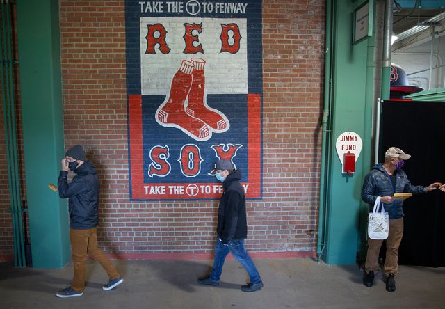 Voters last month wait to turn in their ballots after voting inside Fenway Park in Boston.